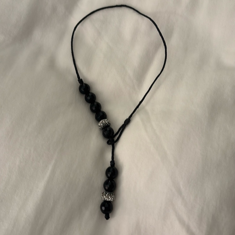 Black bead.necklace with rhinestone beads in between on black cord
